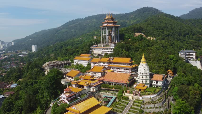 Penang, Malaysia: Aerial drone footage of the famous Kek Lok Si Buddhism temple, from the Chinese tradition, in the island of Penang in Malaysia in Southeast Asia. Shot with an orbit motion. 