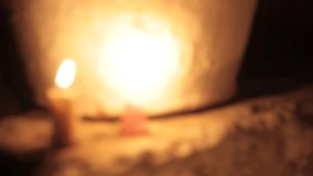 Close-up shot of candles on each step burning in a dark environment, HD video. Concept of connecting with nature, cozy home, spa treatment, Halloween concept, and Christmas Xmas BG.
