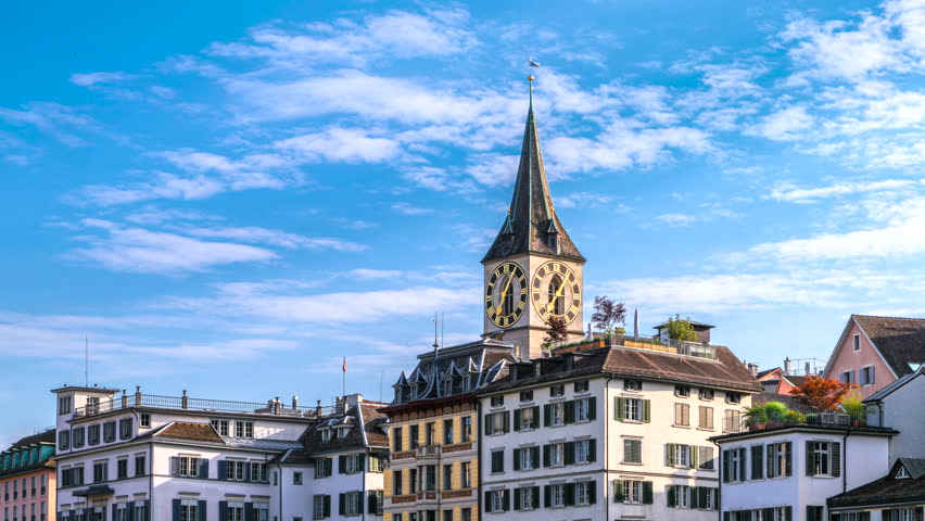 Zoom in time lapse of the bell tower of the church Saint Peter in Zurich with the largest church clock of Europe