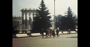 Europe city street on sunny summer morning. People walk in historic town center. Tourism by old building architecture. Archival vintage color film. Archive travel video. Retro 1980s Moscow, Russia