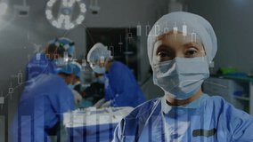 Animation of data processing over portrait of smiling biracial female surgeon in operating theatre. Medical services, technology, data and healthcare concept digitally generated video