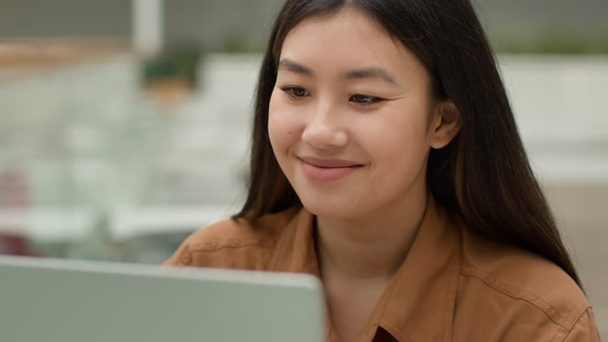 Smiling Asian businesswoman chinese korean japanese multiethnic girl student woman working remote job typing laptop female employee entrepreneur manager sit in office browsing internet web technology - Powered by Shutterstock - Get 15% off with code: PIKWIZARD15