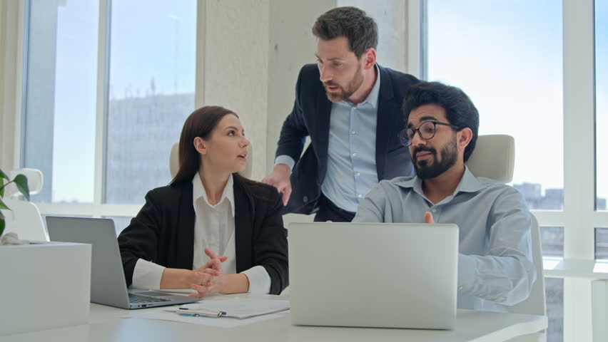 Angry team leader director shouting dissatisfied boss arguing at office meeting annoyed businessman swear employees for mistake wrong failed project on laptop business problem conflict scold workers Royalty-Free Stock Footage #1105603355