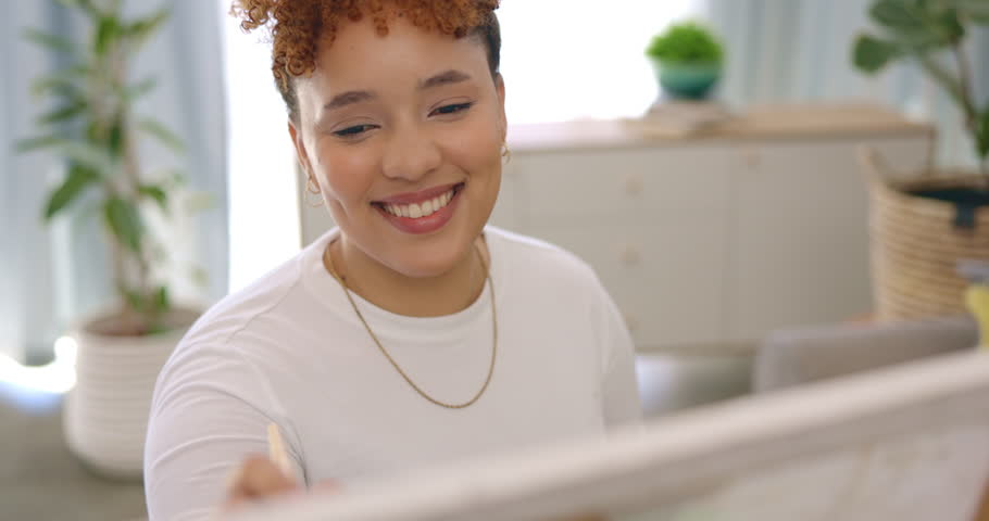 Artist, thinking and painting with brush on canvas, easel or creative studio for painter, student or learning art in home. Happy, black woman and paint with inspiration, idea or expression of emotion