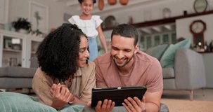 Family, tablet and streaming a movie in home for television series, quality time and mobile app for tv show. Black woman, mom and dad together with child in living room, lounge and watching movies