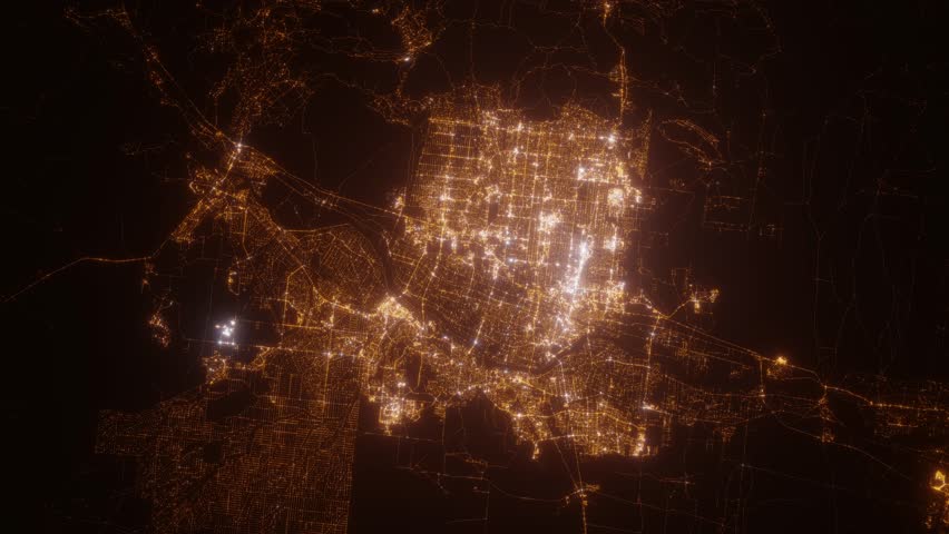 Albuquerque (New Mexico, USA) top view at night. Top view on modern city with street lights and glow effect. Camera is zooming in, rotating clockwise. Vertical video. The north is on the left side