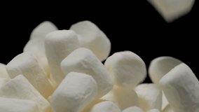 Pile of soft marshmallows falling. Sweet marshmallow falls from top to bottom. - Powered by Shutterstock - Get 15% off with code: PIKWIZARD15