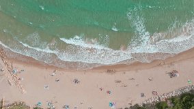 Aerial 4K drone footage of beach in El Roc de Sant Gaietà, a scenic location. Gorgeous little town with stunning views. It is located just outside of Tarragona.