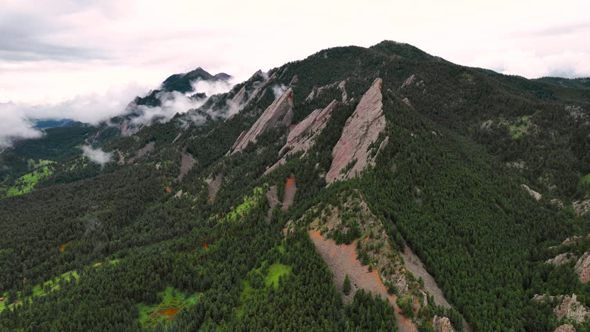 Aerial timelapse of scattered mountain fog around Flatirons, Chautauqua Park