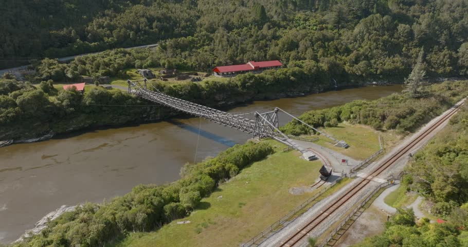 Aerial: Bridge over the Grey River at the remains of the Brunner Coal Mine, Greymouth, New Zealand 