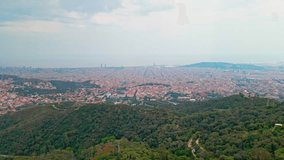 Aerial drone 4K footage of the city Barcelona in Spain. Discover Barcelona's summer magic from above, the vibrant cityscape, iconic landmarks, and sun-kissed Mediterranean coastline.