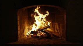Cozy relaxing fireplace. UHD TV screen saver. Video for meditation. Burning Fire In The Fireplace. Slow Motion. A Looping Clip of a Fireplace with Medium Size Flames