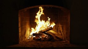Cozy relaxing fireplace. UHD TV screen saver. Video for meditation. Burning Fire In The Fireplace. Slow Motion. A Looping Clip of a Fireplace with Medium Size Flames