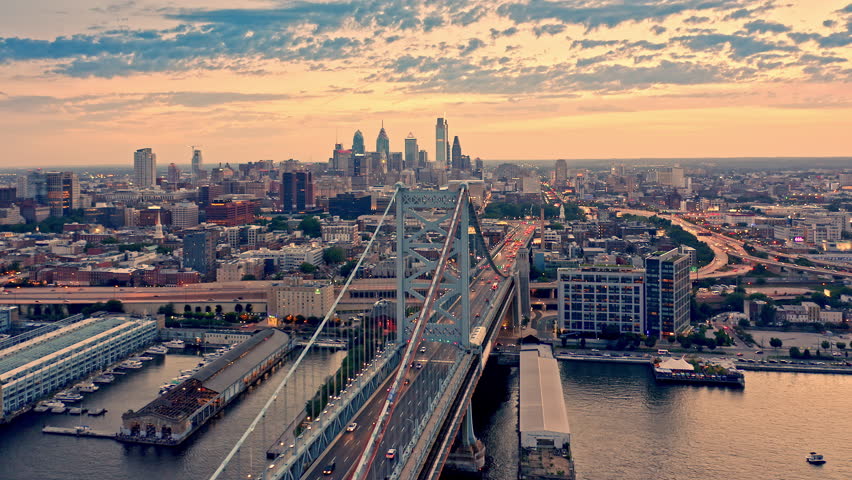 Aerial view of the Philadelphia skyline with a slow camera rotation around Ben Franklin Bridge.