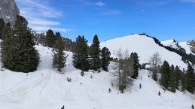 4k video with skiing season footage in the Dolomites mountains in Italy on a beautiful sunny day