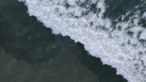 Aerial drone top down view bird eye view of sea blue waves.