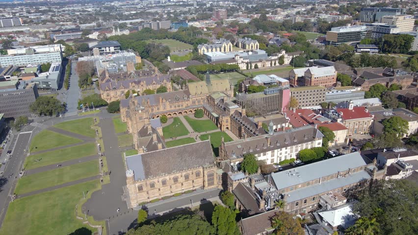 Aerial drone view of the University of Sydney at the Sydney CBD campus, NSW Australia showing the Great Hall on a sunny day    Royalty-Free Stock Footage #1105654947