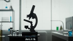 Modern medical research laboratory with a microscope and test tubes with biochemicals on the table. Scientific laboratory. - Powered by Shutterstock - Get 15% off with code: PIKWIZARD15