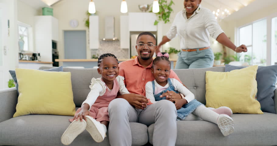 Happy, black family on sofa and in living room of their home happy together for care. Support or love, happiness or positivity and African people cuddle on couch in their house for bonding time Royalty-Free Stock Footage #1105685365