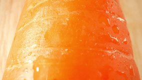 Droplets of water cling to the surface of the carrot, glistening like tiny jewels. The water droplets form small, spherical shapes, delicately resting on the carrot's skin. Carrot background. 4K HDR
 - Powered by Shutterstock - Get 15% off with code: PIKWIZARD15