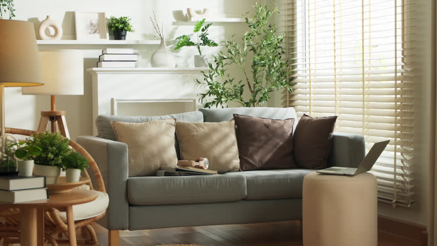 home interior design detail of Modern clean living room with soft and cosy sunlight pillow upholstery cushion arrange on white sofa dolly shot close up,home sweet home background Royalty-Free Stock Footage #1105695263