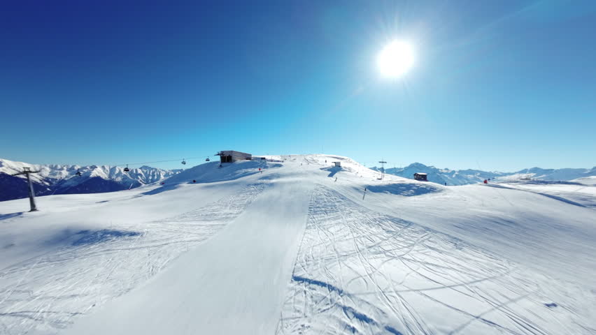 Mountain peak view on the ski slope upwards in obersaxen switzerland in the swiss mountains in graubünden near val lumnezia in surselva with mountain station and ski lift