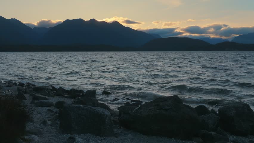 Aerial: wind over Lake at sunset, Lake Manapouri, Southland, New Zealand 