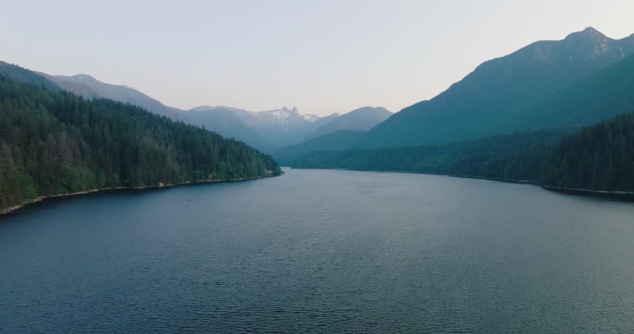 Aerial drone view over picturesque Capilano Lake in North Vancouver, Canada. Royalty-Free Stock Footage #1105705803
