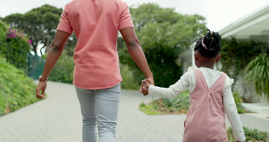 Dad, girl walking and holding hands together at front door, house and coming home from the backyard, garden or back entrance. Black man, child and return from holiday, weekend or walk on path