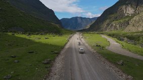 Driving along a mountainous rocky road. Video from the drone.