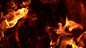 Vertical fire flames, slow motion footage, abstract background. Motion backgrounds. Abstract blurred burning video with copy space.
