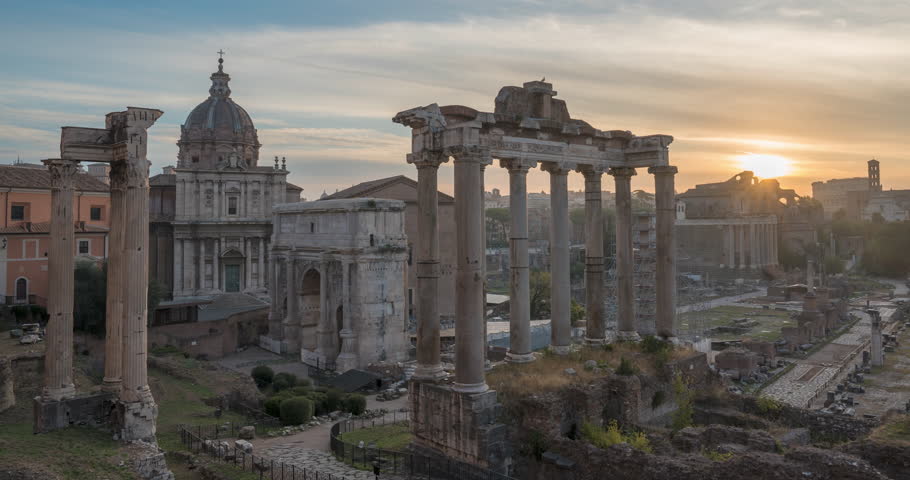 Morning time-lapse of historic Roman Forum ruins. Sunrise over Forum Romanum famous ancient travel landmark of Rome, Italy. Archaeological site and popular tourist attraction in center of the city.