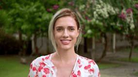 Beautiful 30s woman portrait. Pretty american girl look camera. White teeth smile close up. Cute joy blond person head shot. One nice lady walk park. Happy female face portraits. Young adult 20s model - Powered by Shutterstock - Get 15% off with code: PIKWIZARD15