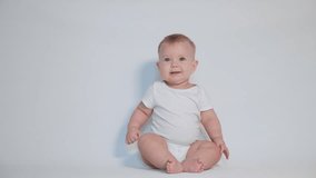the child learns to crawl, video on a light studio background