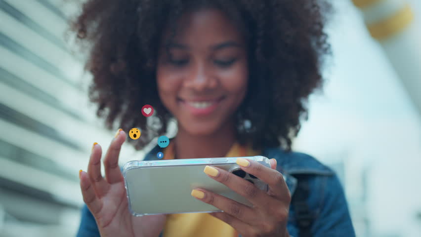 Woman hands using smartphone watching a live stream in the city, Happy female using social media on their mobile phone. - Powered by Shutterstock - Get 15% off with code: PIKWIZARD15