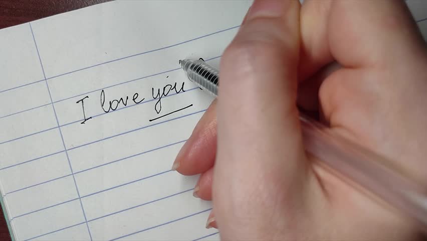 Hand writing on a paper about self-love