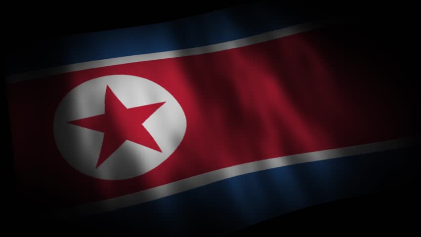 The North Korean flag is in a diagonal close-up.