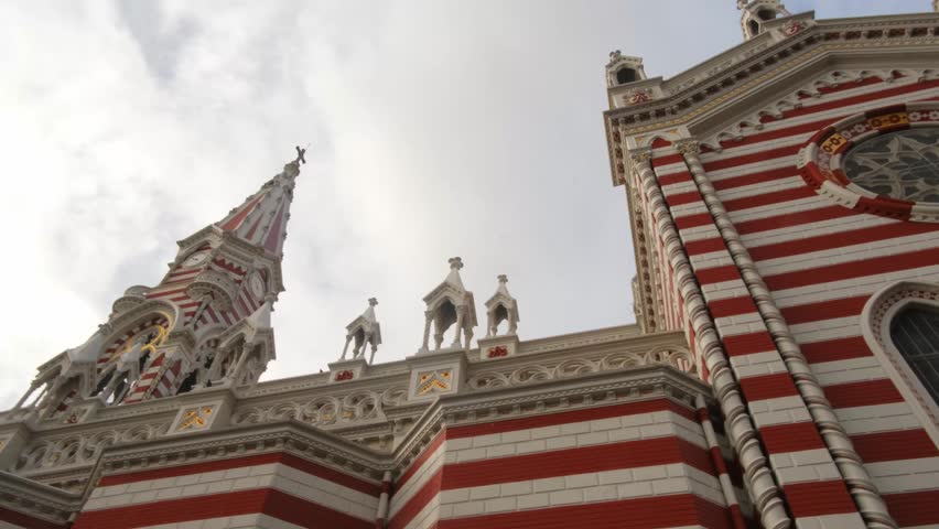 Church El Carmen in Bogota, Colombia, low angle panning shot.