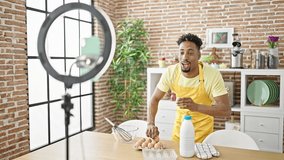 African american man chef recording video cooking at dinning room