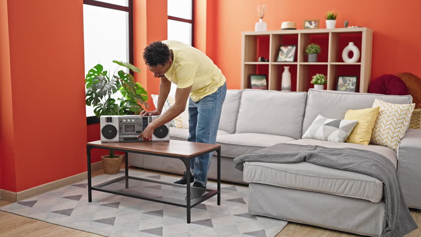 African american man smiling confident dancing at home