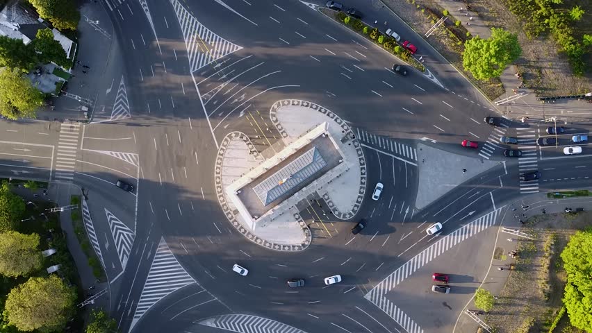 4K Top Down aerial Drone view of cars driving around a picturesque roundabout in Eastern Europe. Arcul de Triumf Bucharest. The Triumfal Arch Bucuresti. Royalty-Free Stock Footage #1105745203