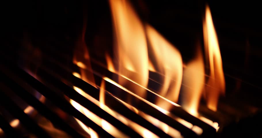 The fire burns through the grill grate. Hellish barbecue. Hearth in the fireplace. Royalty-Free Stock Footage #1105747999