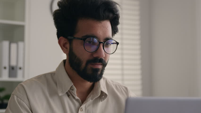 Tired exhausted Arabian business man Indian muslim businessman overworked manager working laptop in office take off glasses rubbing dry irritated eyes bad vision eyesight eyestrain problem take break Royalty-Free Stock Footage #1105748663