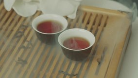 A beautiful composition with cups of pu-erh tea and steam. Amber tea in the clouds - Powered by Shutterstock - Get 15% off with code: PIKWIZARD15