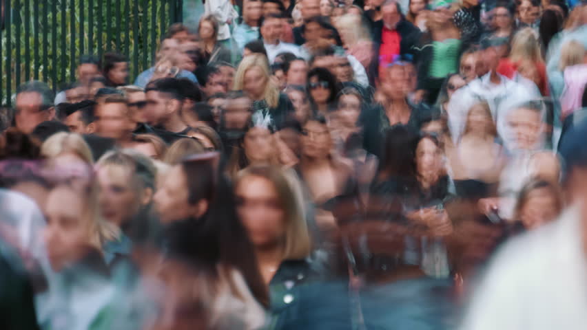 Time-lapse unrecognizable blurry lot of people crowd crossing city street, busy crossroad, many pedestrians crossing crosswalk. Timelapse rush hour crowded people walk, blurred fast motion | Shutterstock HD Video #1105754197