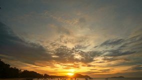 time lapse clouds moving in yellow sky in sunrise moving slowly above islands at Rawai beach Phuket. 
Nature video High quality footage.
Scene of Colorful sky sunset with cloud background.