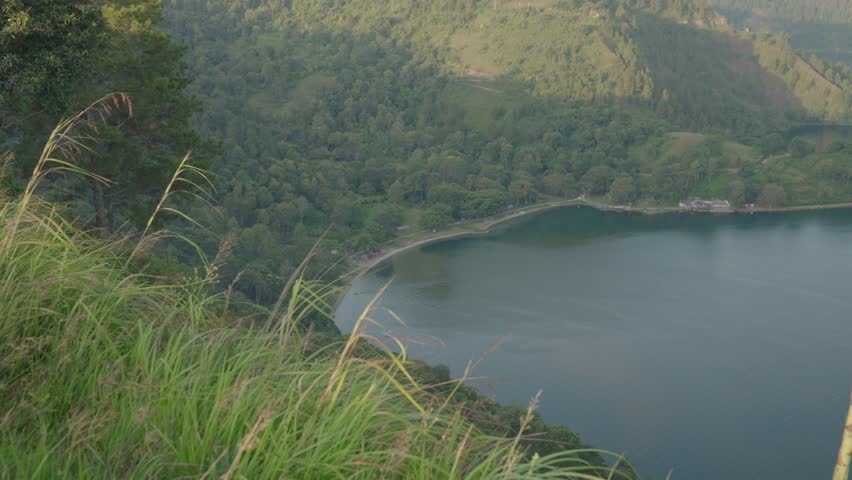 Danau Toba view from Tarabunga Hill - a Large Natural Lake in North Sumatra, Indonesia, Occupying The Caldera of a Supervolcano Royalty-Free Stock Footage #1105759077