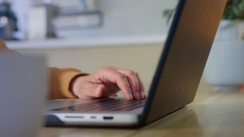 The old man is working on a laptop. A pensioner types with his fingers on a computer keyboard. An old man has a freelance job outside the house. Modern work for seniors. Close up - Powered by Shutterstock - Get 15% off with code: PIKWIZARD15
