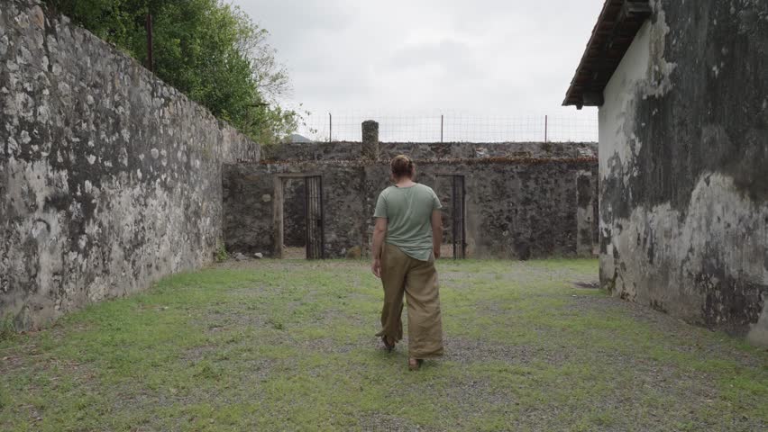 Tourist Walking Inside The Ancient Prison Camp In Con Dao, Ba Ria Vung Tau In Vietnam. Slow Motion