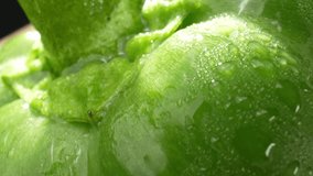 Captivating macro video showcasing vibrant green bell peppers adorned with glistening droplets of water. Shot with a probe lens, revealing intricate details. Bell peppers background. 4K HDR
 - Powered by Shutterstock - Get 15% off with code: PIKWIZARD15